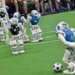 Robots fight for the ball during their football match in the standard platform league tournament at the RoboCup 2017 in Nagoya, Aichi prefecture on July 30, 2017