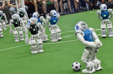 Robots fight for the ball during their football match in the standard platform league tournament at the RoboCup 2017 in Nagoya, Aichi prefecture on July 30, 2017