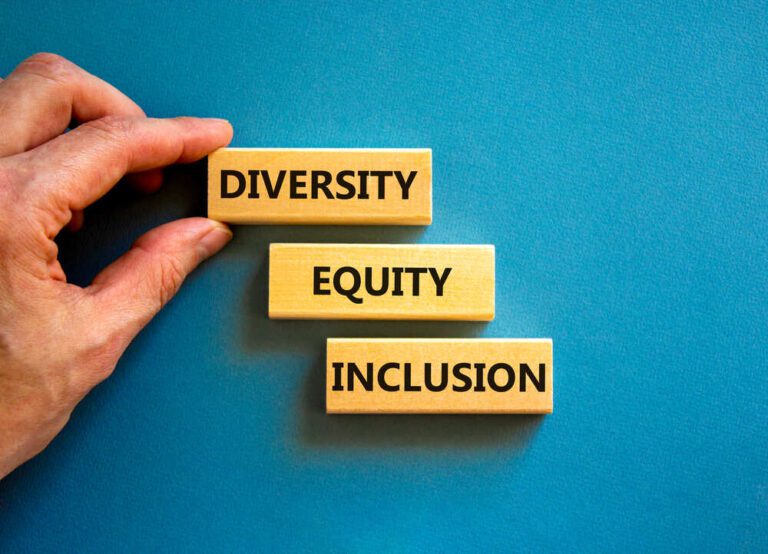 Diversity equity inclusion symbol. Concept words diversity equity inclusion on blocks on beautiful blue table blue background. Businessman hand. Business, diversity equity inclusion concept.