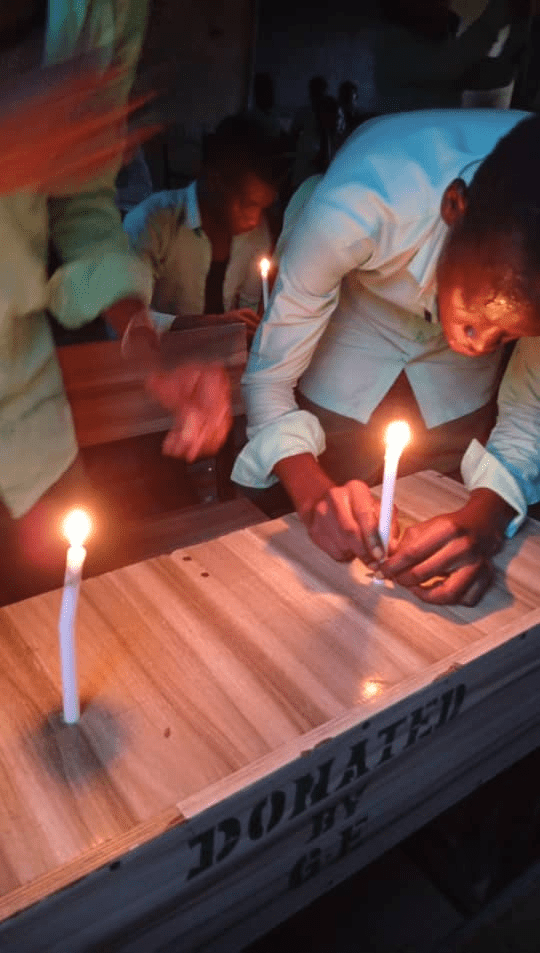 WAEC students writing exams late at night