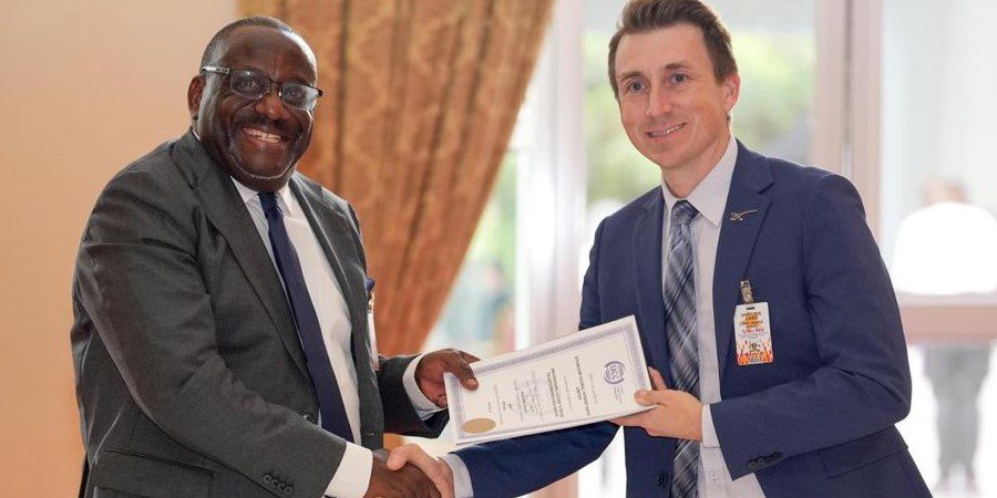 Director of Starlink Market Access & Development, Ryan Goodnight, and the Executive Director of Uganda Communications Commission, Nyombi Thembo