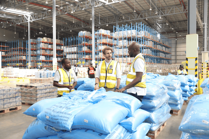Twiga Foods CEO Charles Ballard (centre) shares a moment with Chief Technology Officer Paul Bombo (right) during a tour of the company's facility at Tatu City. Looking on is Facility Manager Kennedy Muchiri. (Photo: Business Today)